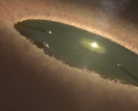 Так художник представляет себе планеты, образовавшиеся возле GM Aurigae. Изображение NASA/Caltech/Spitzer Science Center с сайта www.space.com