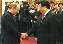 Владимир Путин и председатель КНР Ху Цзиньтао. Кадр НТВ